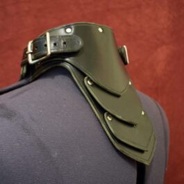 A close up of a Handmade Leather Gorget Style 1 on a suitcase.