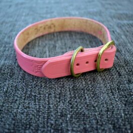 a pink Handmade Leather Dog Collar with gold buckles.