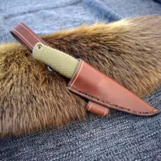 a leather knife holder with fur on top of it.