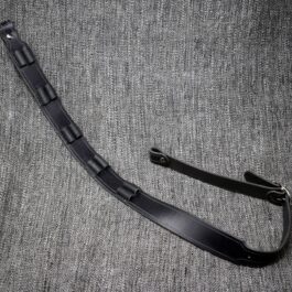 A black Handmade Leather Rifle Sling with vertical ammo loops laid on a cloth - Grommet's Leathercraft - renaissance clothing - renaissance art clothing - renaissance era clothing - leathercraft supplies - leathercraft accessories - leathercraft store near me - quality leather craft