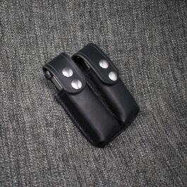black 1911 Double Magazine Pouch laid on a cloth - renaissance clothing - renaissance clothing men - renaissance clothing women - renaissance clothing near me - renaissance art clothing - renaissance era clothing - renaissance costume ideas
