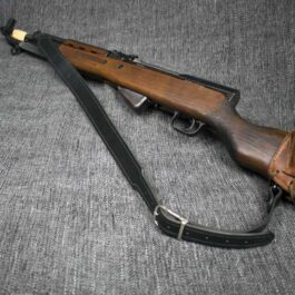 A black Handmade Leather Rifle Sling attached to a rifle - Grommet's Leathercraft - renaissance clothing - renaissance art clothing - renaissance era clothing - leathercraft supplies - leathercraft accessories - leathercraft store near me - quality leather craft