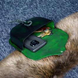 A dog's head with a Molded Leather Belt Pouch attached to it.