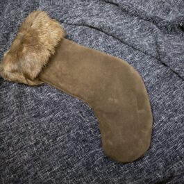 a piece of fabric with a fur on top of it.