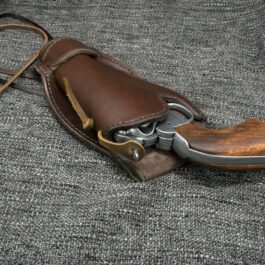 a Gunslinger Holster with a knife inside of it.