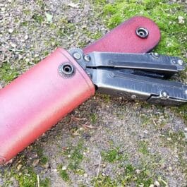 A Handmade Leather Pouch laying on the ground.