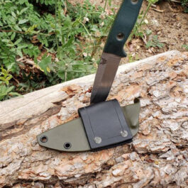 The Scout Style Benchmade Bushcrafter Sheath Style 2 that is on top of a piece of wood.