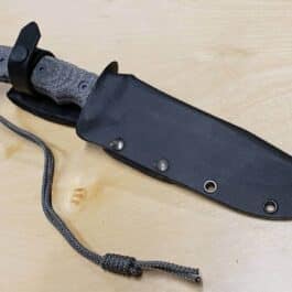 a Kydex Sheath for the Chris Reeve Pacific with a cord attached to it.