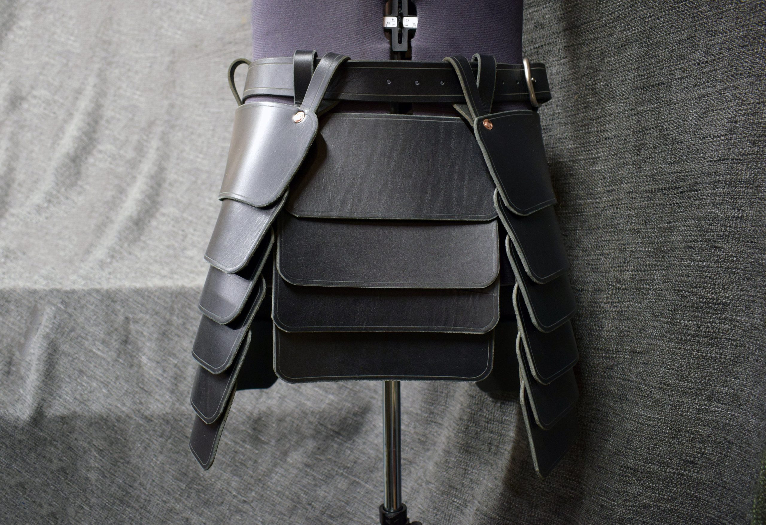 the back of a person's backpack hanging on a wall.