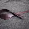 A Buscadero Gunbelt laying on a gray cloth.