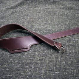 A Buscadero Gunbelt laying on a gray cloth.