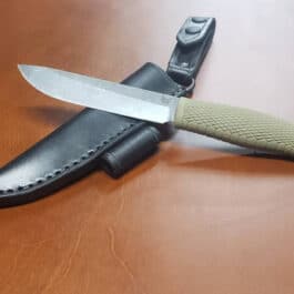 a knife laying on top of a knife holder.