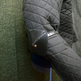 A close up of a person's arm wearing Simple Leather Elbow Armor.