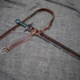 A Custom Leather Scabbard attached to the knife.