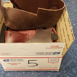 a box with a pair of shoes inside of it.