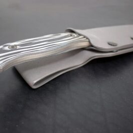 a close up of the Kydex Sheath for the Benchmade Saddle Mountain Hunter on a table.