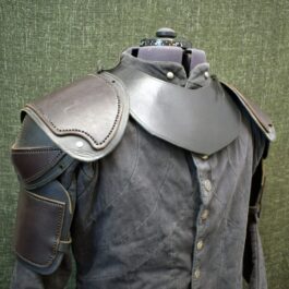 a close up of a leather armor on a mannequin.
