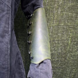 a pair of Soft Leather Mirkwood Vambraces with laces attached to them.