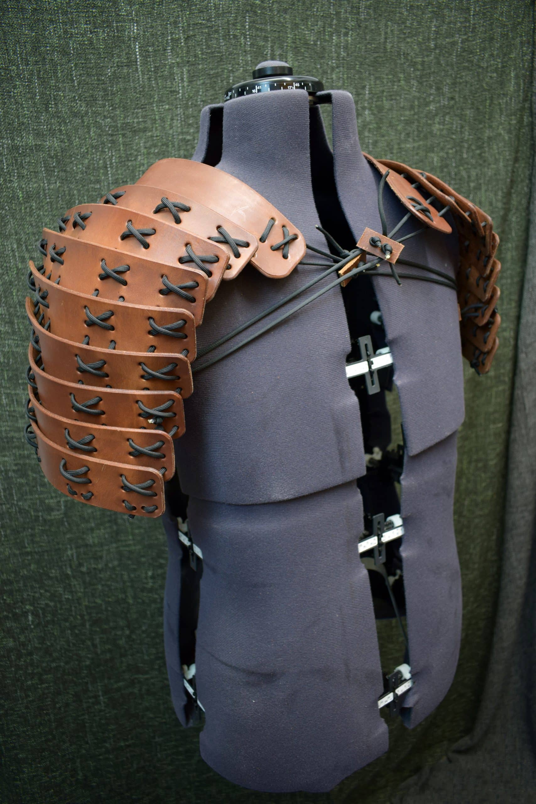 The back of a mannequin's torso with leather straps was replaced by Samurai Style Torso Armor.