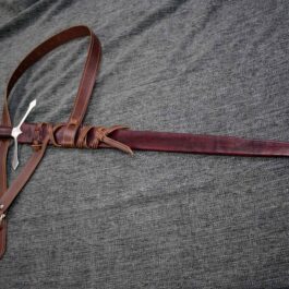 A Custom Leather Scabbard attached to a knife.