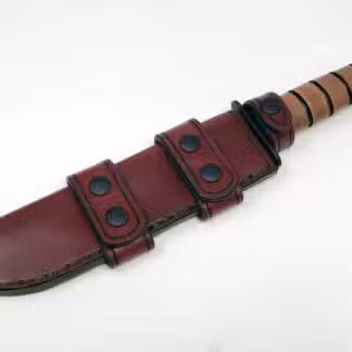 a knife with a leather sheath on a white background.