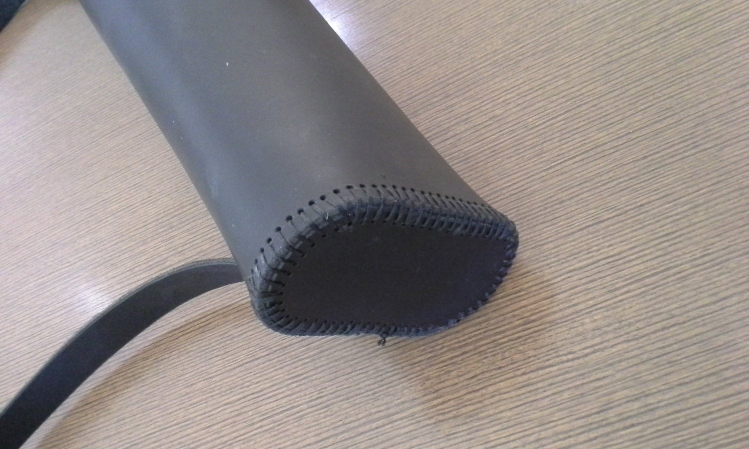 a close up of a Basic Back Quiver on a table.