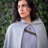 A young man dressed in a Wool Hooded Cloak.