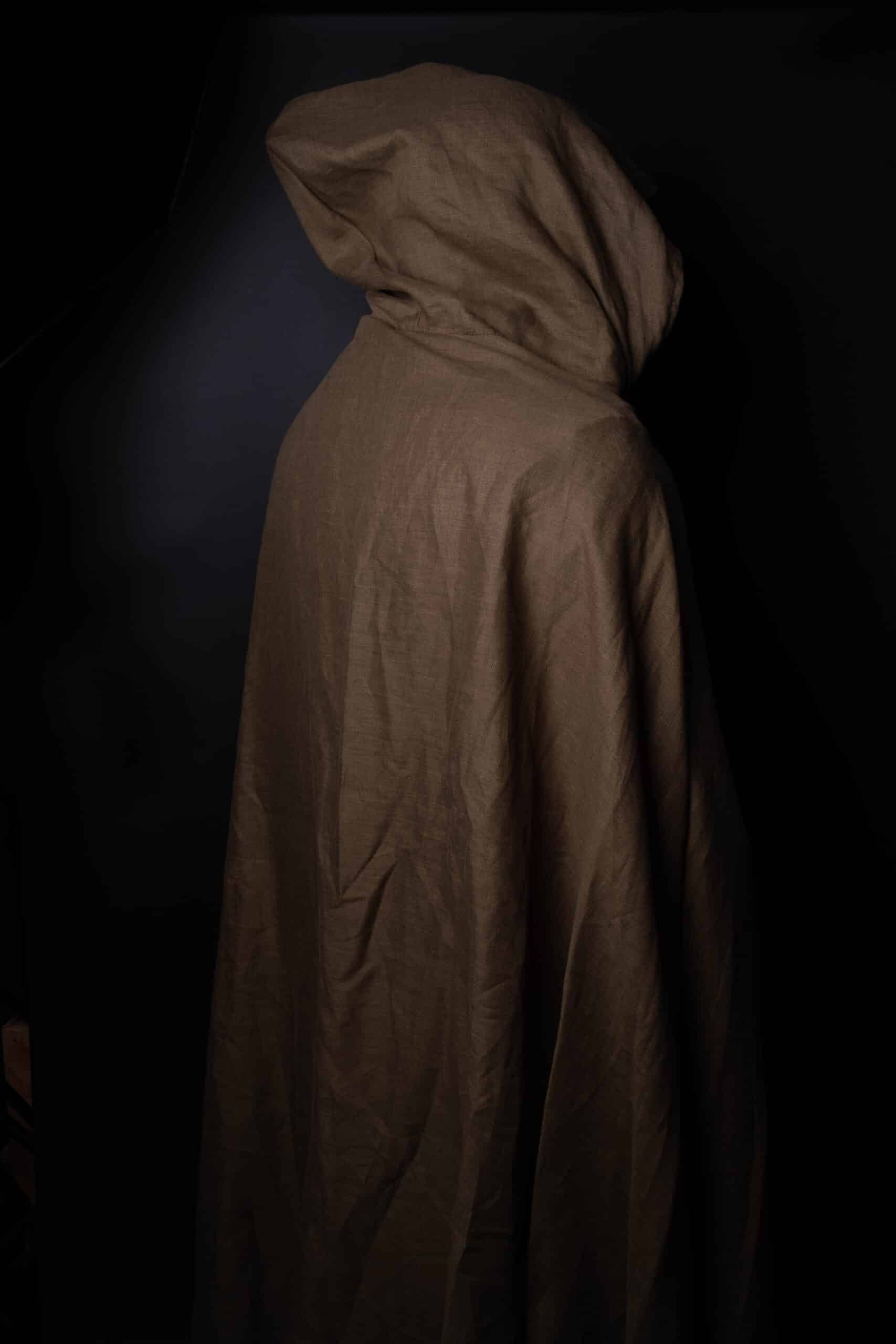 a person in a Wool Hooded Cloak in the dark.