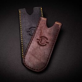 A pair of Handmade Bison Leather Pocket Slips sitting on top of a table.