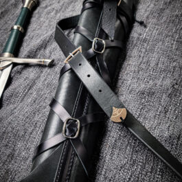 A Striders Quiver laying on top of a gray blanket.