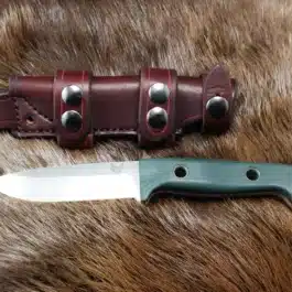 Scout Style Leather Sheath for the Benchmade Bushcrafter and knife laying next to each other.