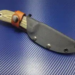 a Benchmade Pardue Hunter with a Kydex sheath on a blue surface.