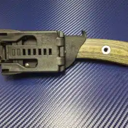 a close up of a Kydex Sheath for the Benchmade Pardue Hunter on a table.