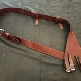 brown Ranger baldric laid on a cloth - renaissance clothing - renaissance clothing men - renaissance clothing women - renaissance clothing near me - renaissance costume ideas - sword baldrics - baldrics leather - baldric belt
