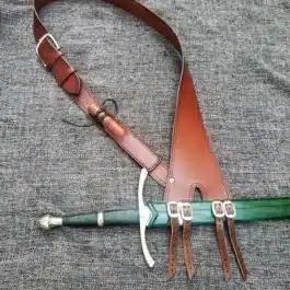 brown Ranger baldric laid on a cloth - renaissance clothing - renaissance clothing men - renaissance clothing women - renaissance clothing near me - renaissance costume ideas - sword baldrics - baldrics leather - baldric belt