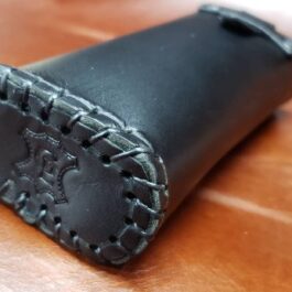 A close up of a Handmade Leather Glasses Case on a table.