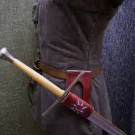 A Handmade Leather Sword Hanger with a wooden handle and a leather sheath.