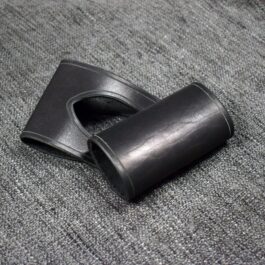 A Handmade Leather Sword Hanger laying on a gray carpet.