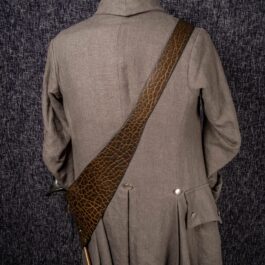 The back of a man's coat with a Bison Leather Baldric.