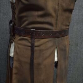 a man wearing a Strider Belt with a white shirt and brown outfit.