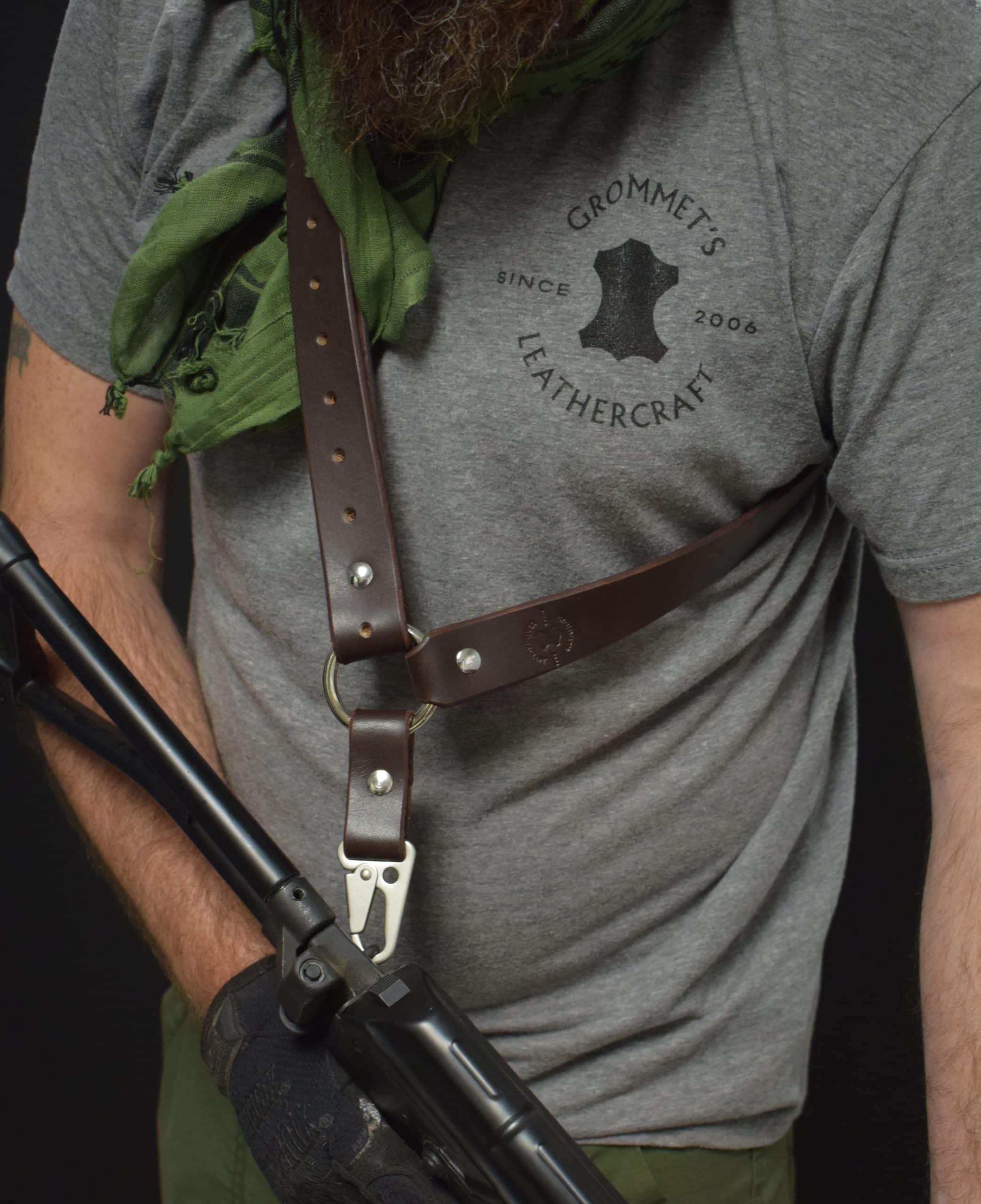 Man with a beard wearing a grey shirt and a leather single point sling - Grommet's Leathercraft - renaissance clothing - renaissance art clothing - renaissance era clothing - leathercraft supplies - leathercraft accessories - leathercraft store near me - quality leather craft