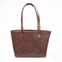 A Horween leather tote bag on a white background.
