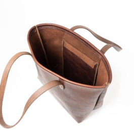 A Horween Leather Tote Bag with a long strap.