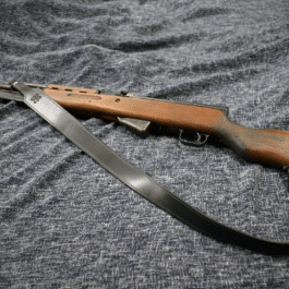 A black Handmade Leather Cobra Rifle Sling with black lining attached to a rifle - Grommet's Leathercraft - renaissance clothing - renaissance art clothing - renaissance era clothing - leathercraft supplies - leathercraft accessories - leathercraft store near me - quality leather craft