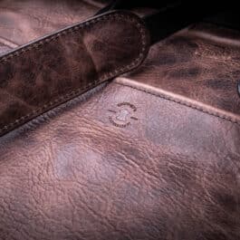 A close up of a Bison Leather Briefcase Satchel.