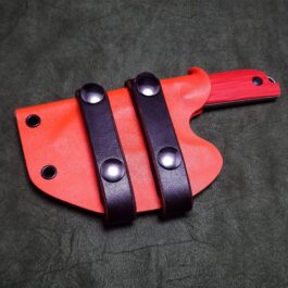 a Kydex sheath for the Benchmade Nestucca Cleaver with two black handles.