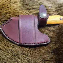 A Leather Scout Sheath for the Benchmade Nestucca Cleaver with a wooden handle.