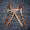 brown Handmade Leather Lederhosen Suspenders laid on a cloth - renaissance clothing - renaissance clothing men - renaissance clothing women - renaissance clothing near me - renaissance art clothing - renaissance era clothing - renaissance costume ideas