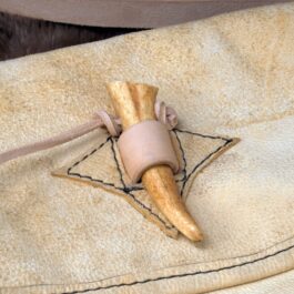 a Brain Tan Frontiersman Saddlebag on top of a piece of cloth.