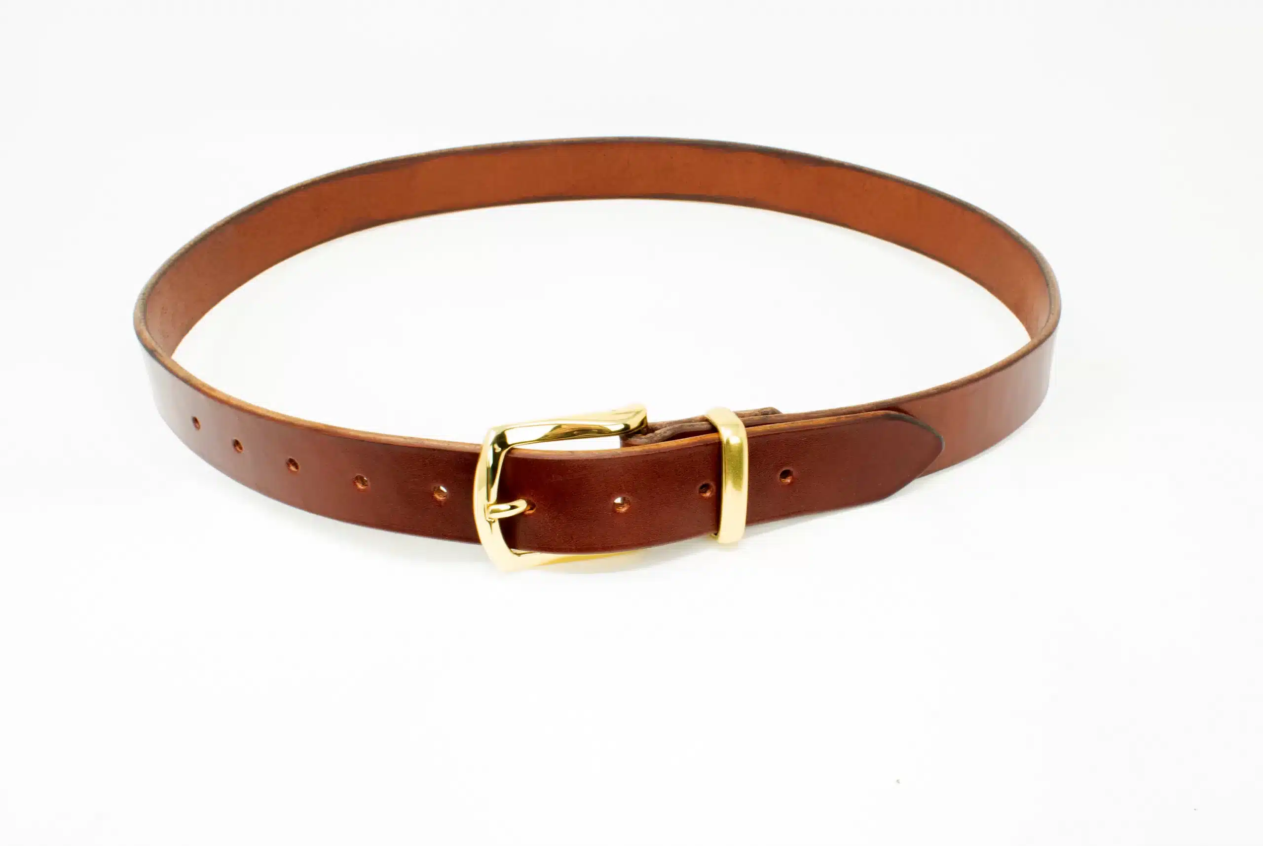 A Handmade Leather Dress Belt with a gold buckle.